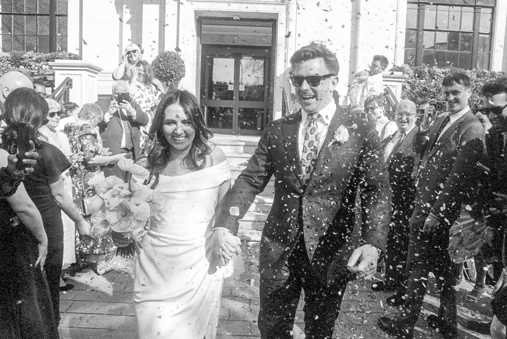 married-couple-exit-civil-office-covered-in-confetti.jpg