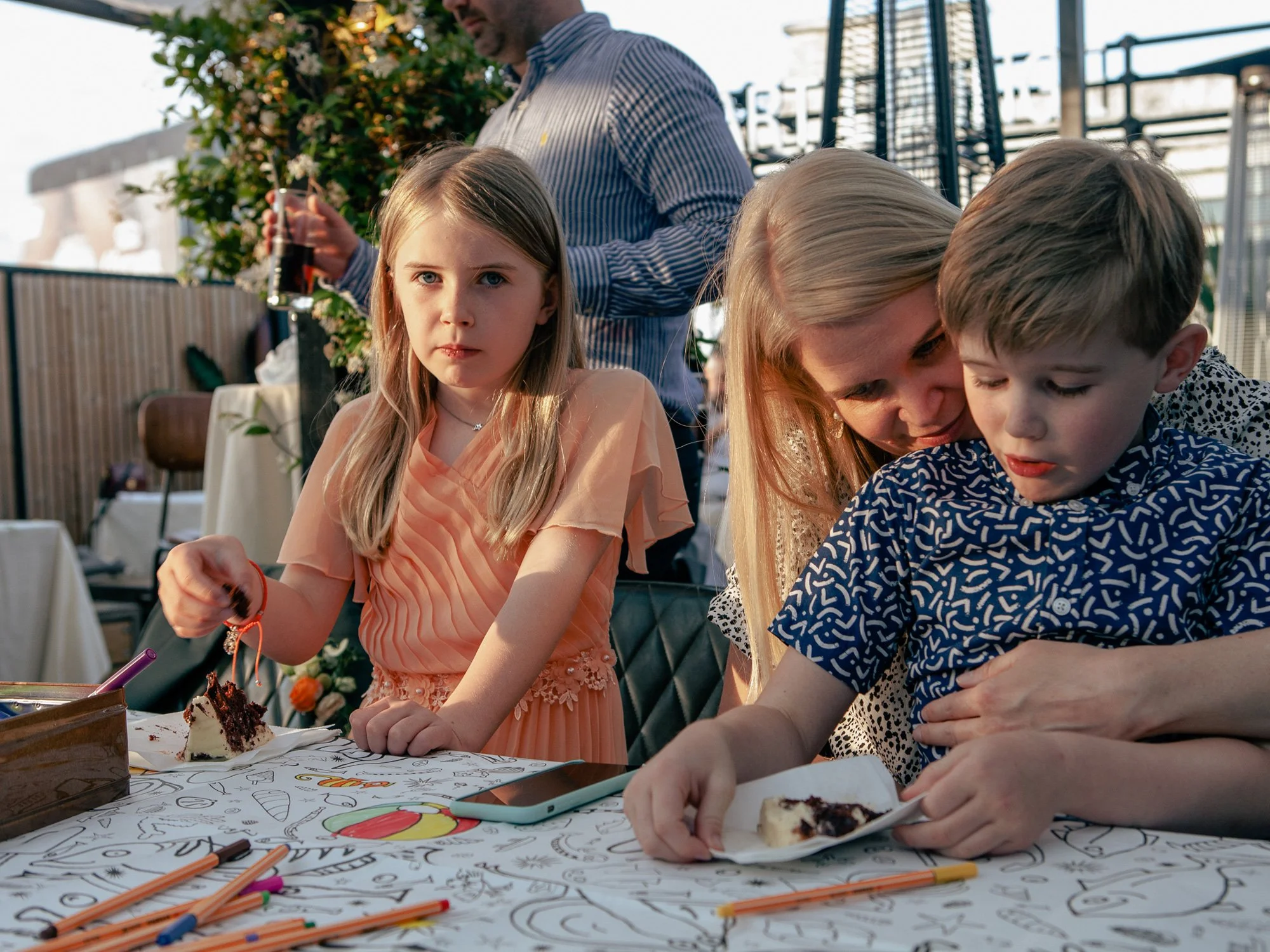 Kids-with-cake-and-drawing-materials-at-wedding.jpg