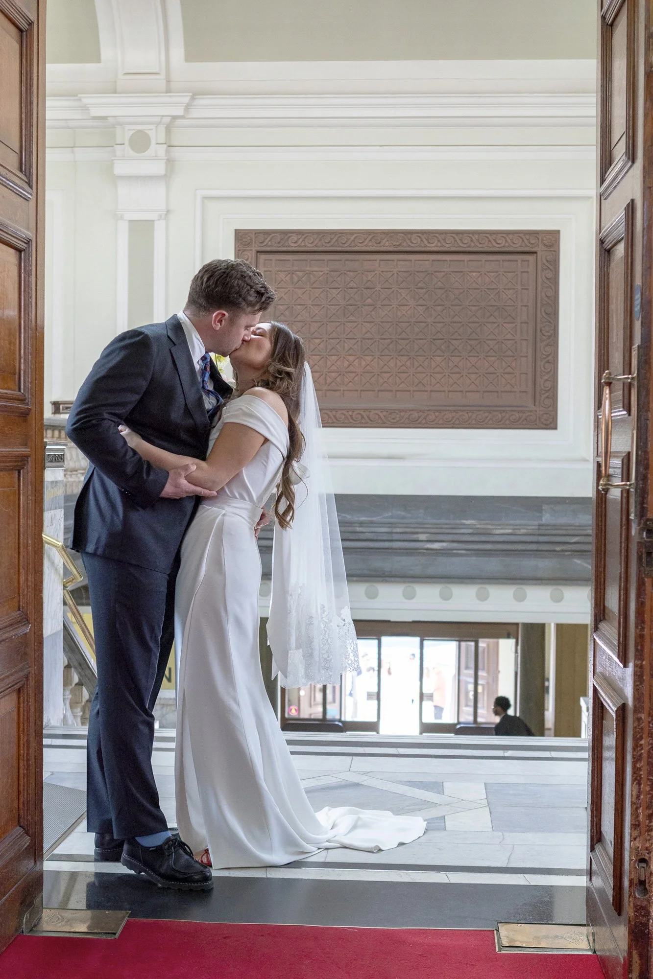 Couple-pose-at-wedding-in-door-frame.jpg