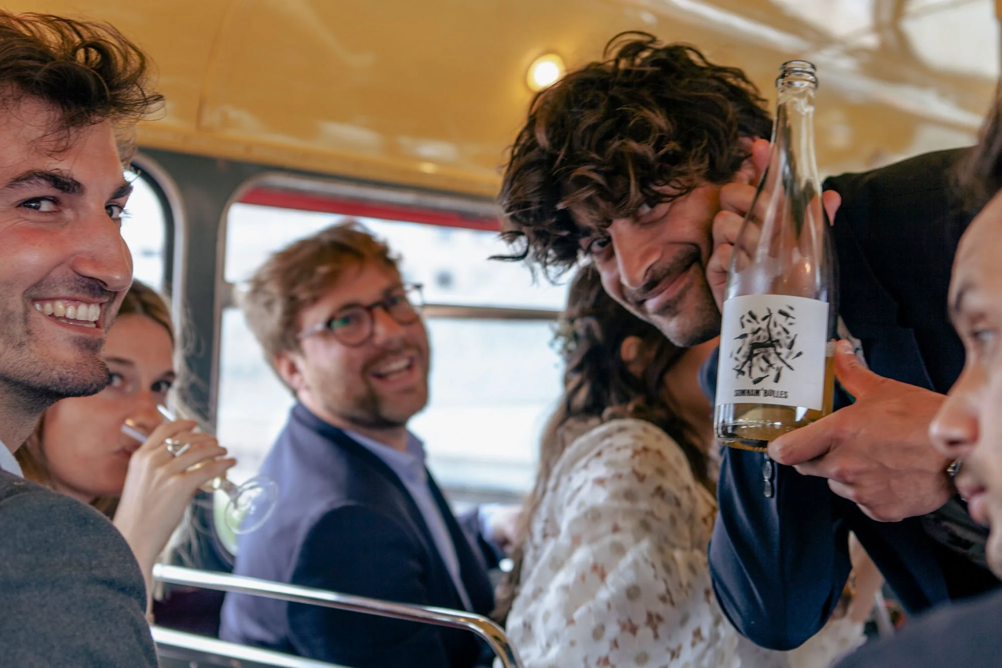 couples enjoying drinks on double decker bus.jpg