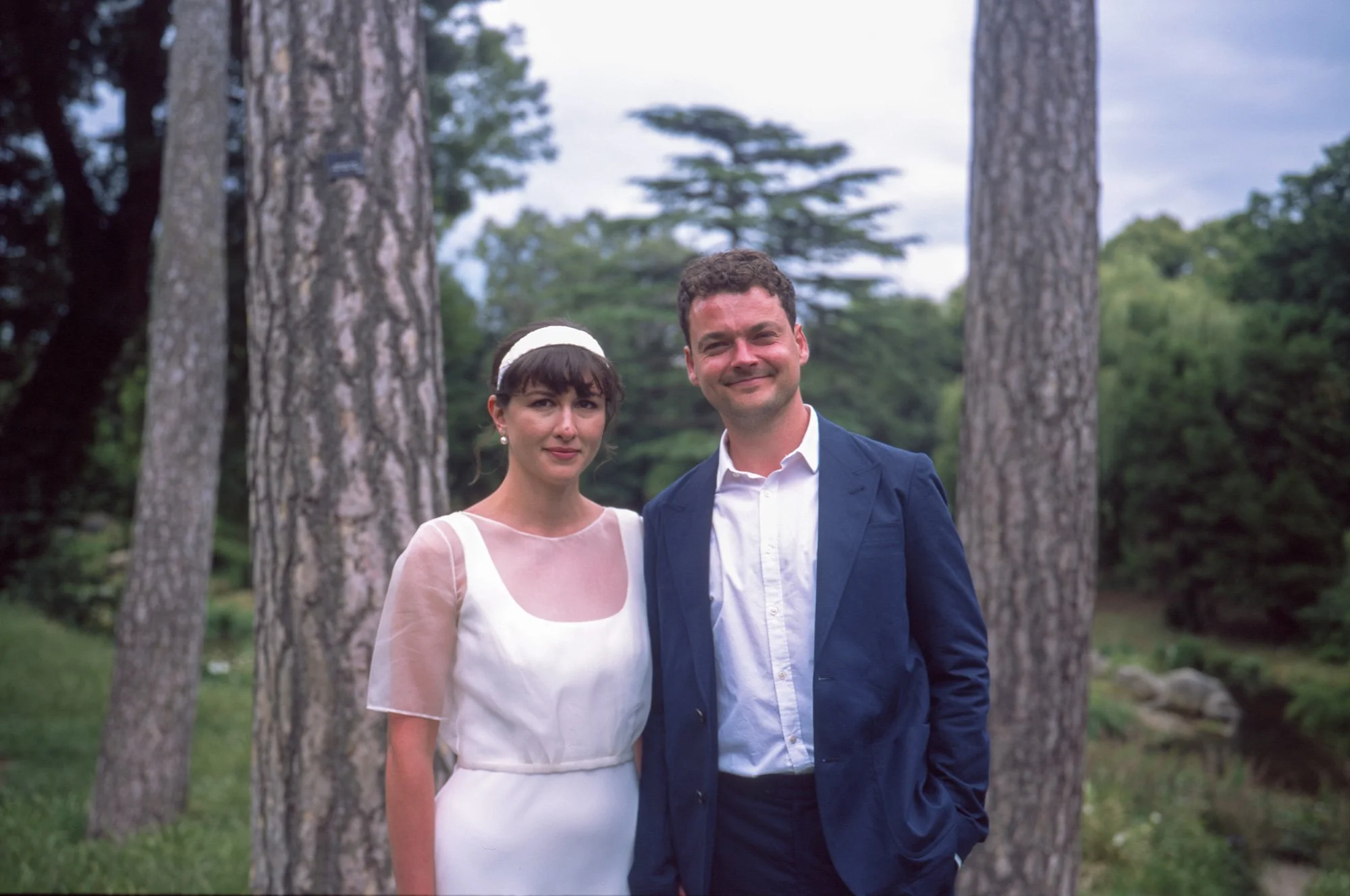 Wedding-couple-at-the-park-in-front-of-trees.jpg