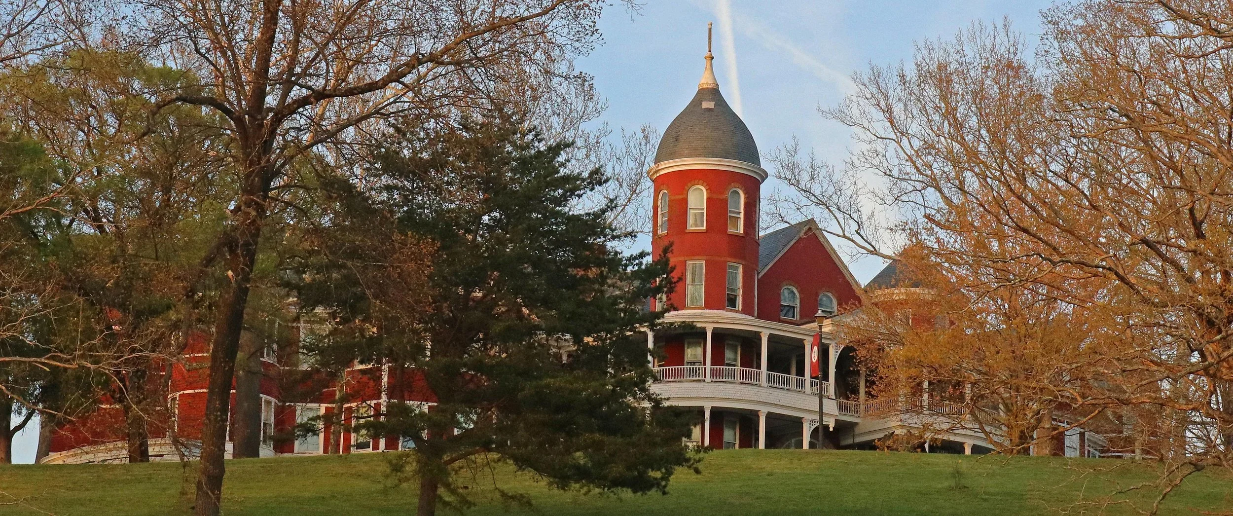 Huge red Queen Anne building surrounded by mature treesOriginally Built as a Buena Vista Hotel in the 1890’s, now the main building of Southern Virginia University.