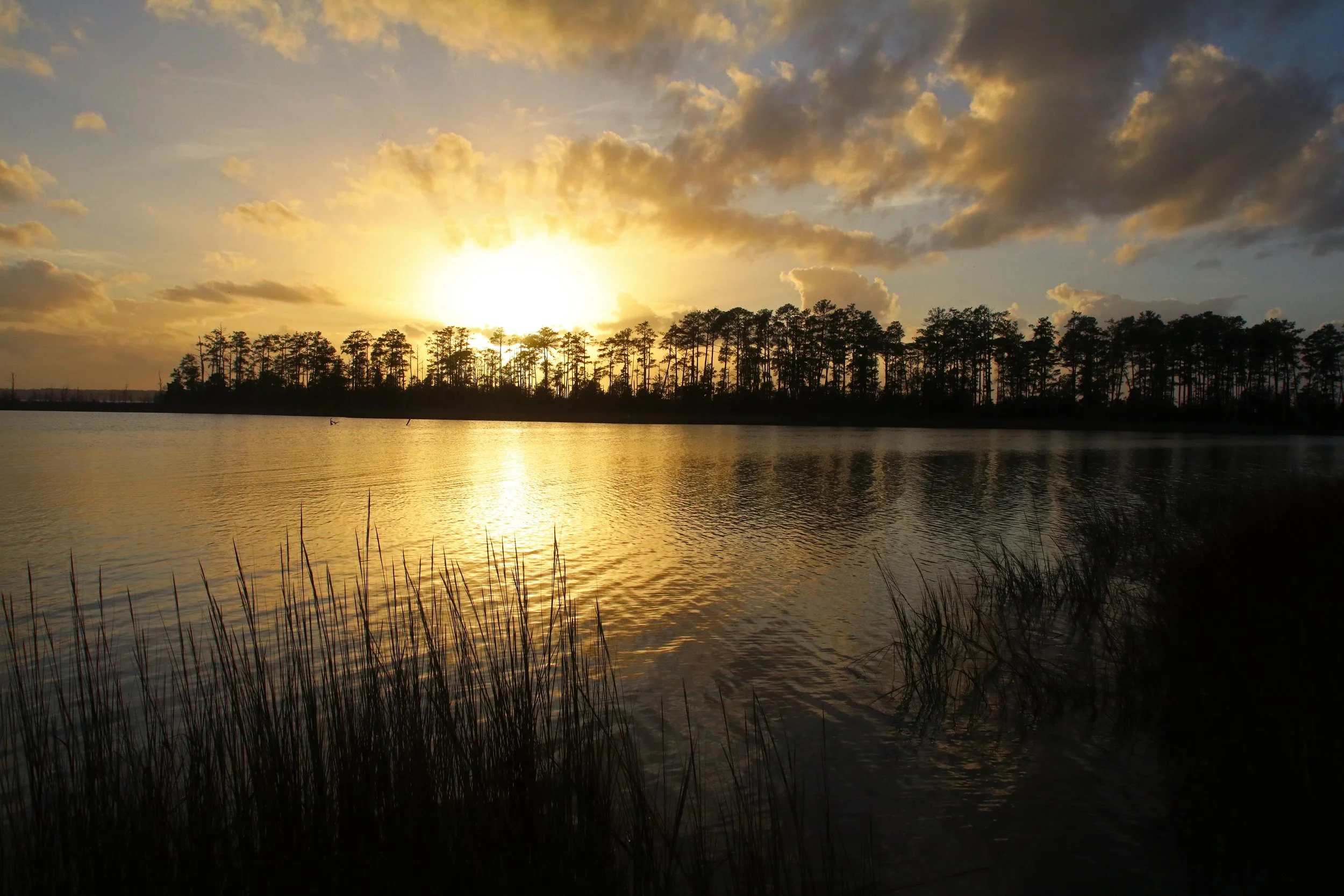 Sunset over water at Machicomoco State Park in Virginia
