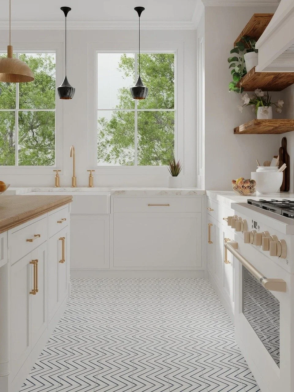 Bright white kitchen with gold hardware, black pendant lights, wooden shelves with plants, patterned black and white floor tiles, large windows showing green trees outside.