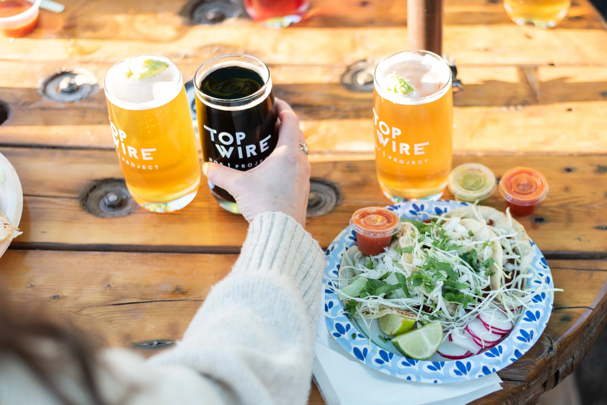 TopWire has a food truck pop serving food including a taqueria, burgers and salads, pizza, ice cream, Indian food and more.