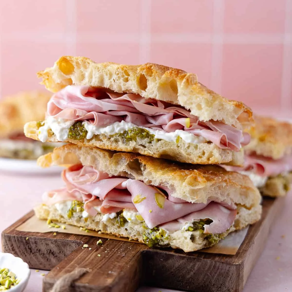 Felicious Focaccia sandwich with Mortadella, Cheese, and Pesto.