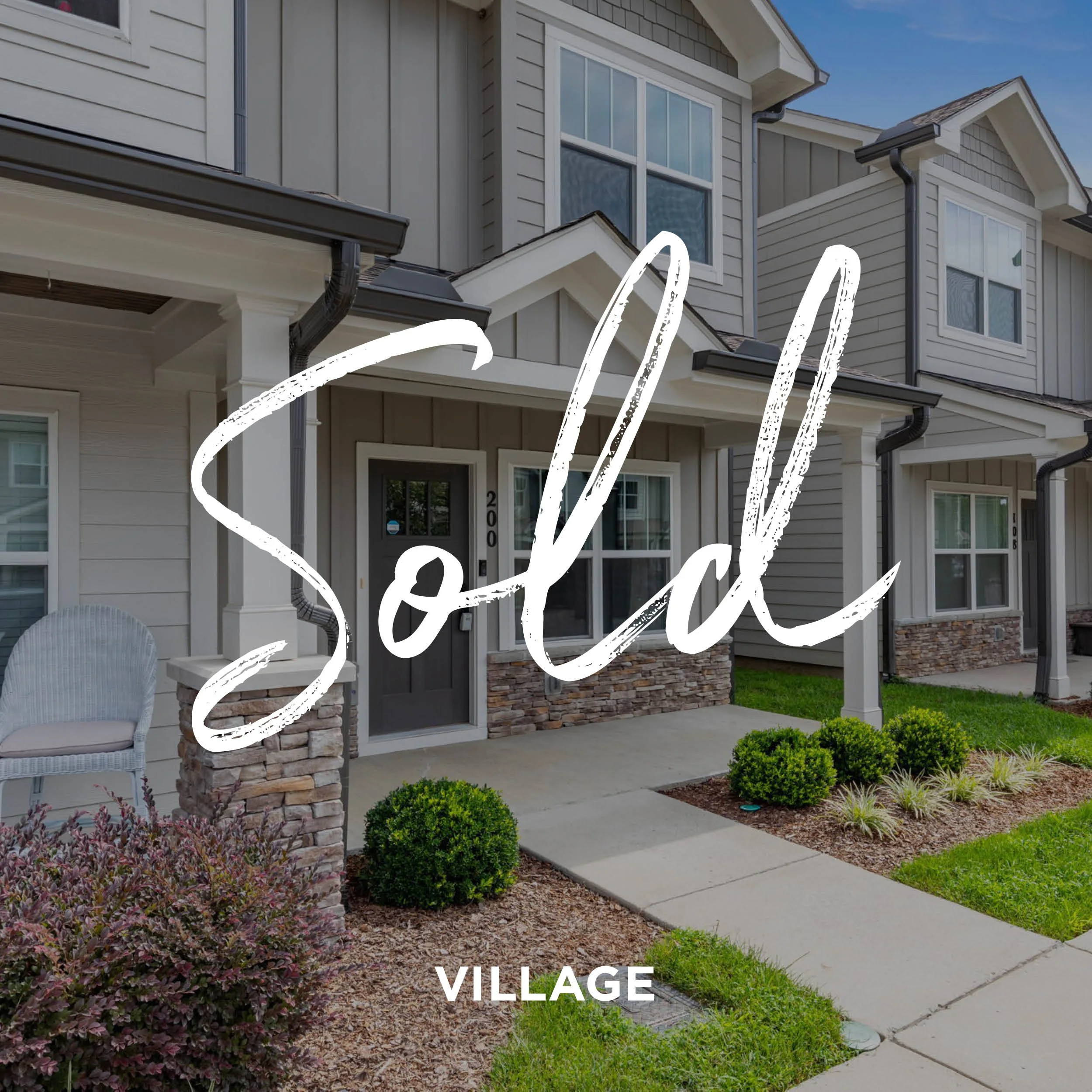 A row of new townhouses with well-maintained front yards, concrete walkways, and a 'Sold' overlay.