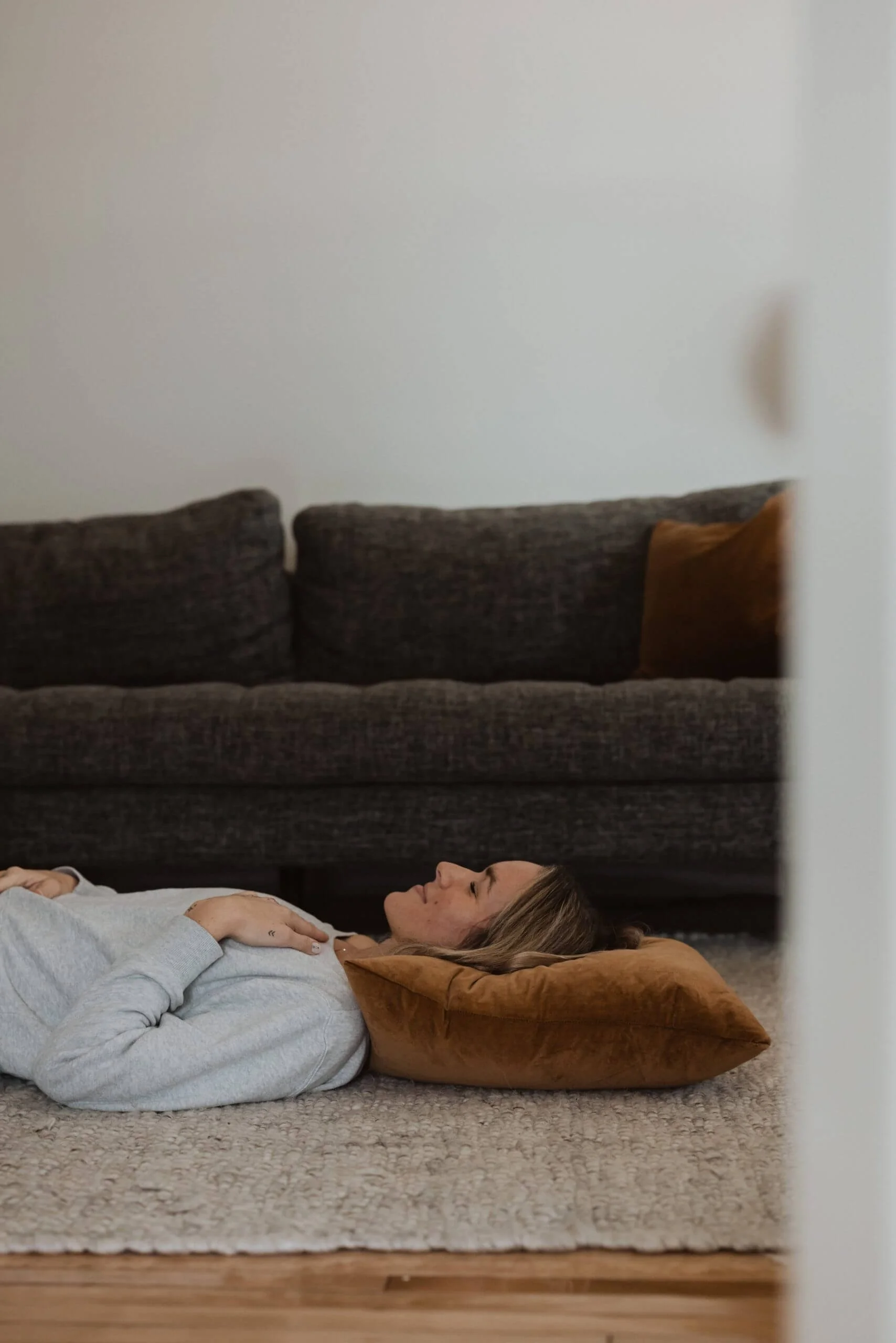 woman laying on living room floor.jpg