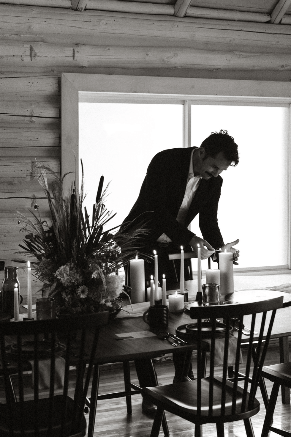 man setting up dinner.png