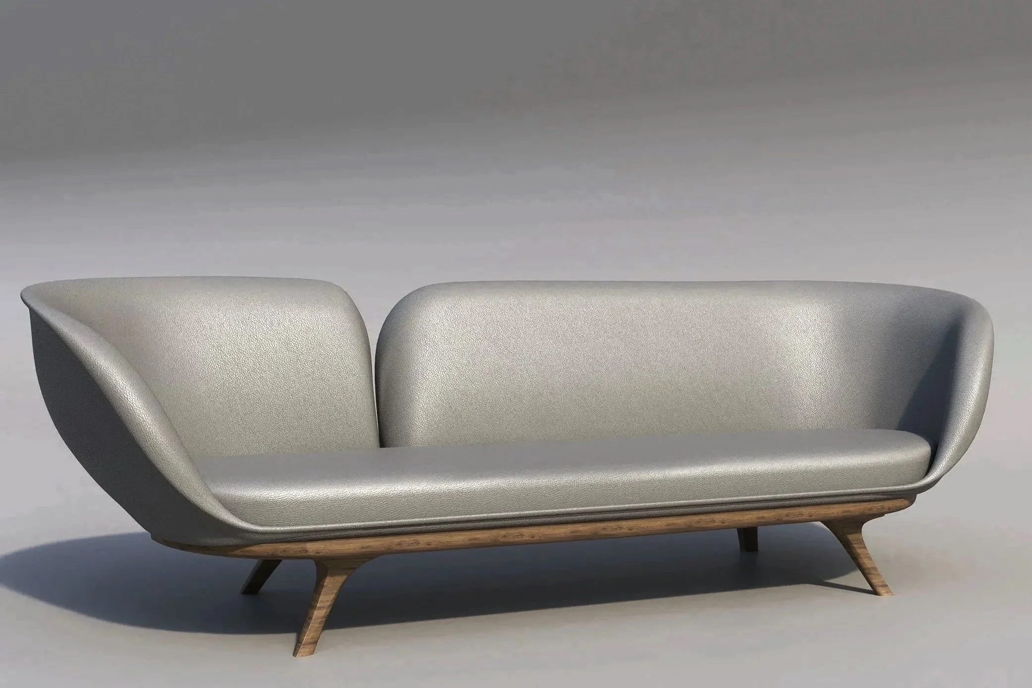 A modern silver sofa with wooden legs against a plain gray background.