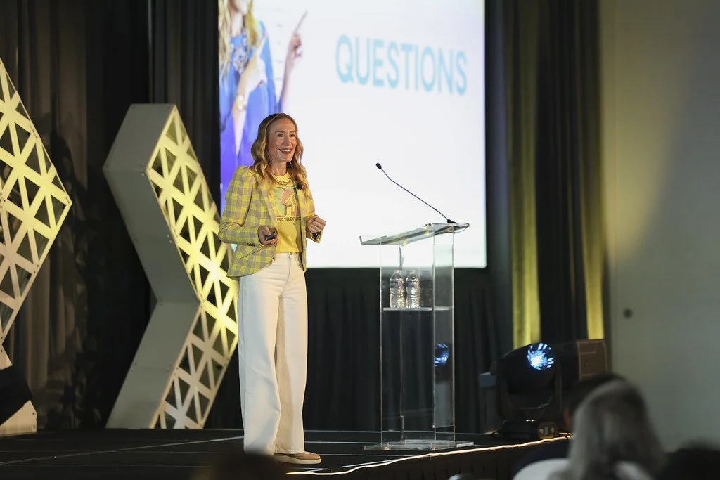 Whether she's giving a keynote on the main stage, behind a media interview, Erin brings her tell-it-like-it-is personality, humor, and an unmistakable energy to make people feel instantly seen.