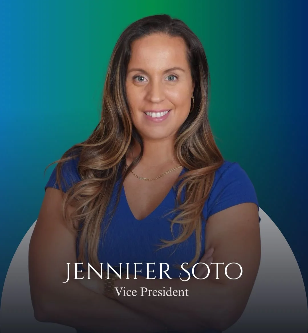 Professional headshot of Jennifer Soto, Vice President, smiling with arms crossed, wearing a blue top and gold jewelry, against a colorful green and blue background.