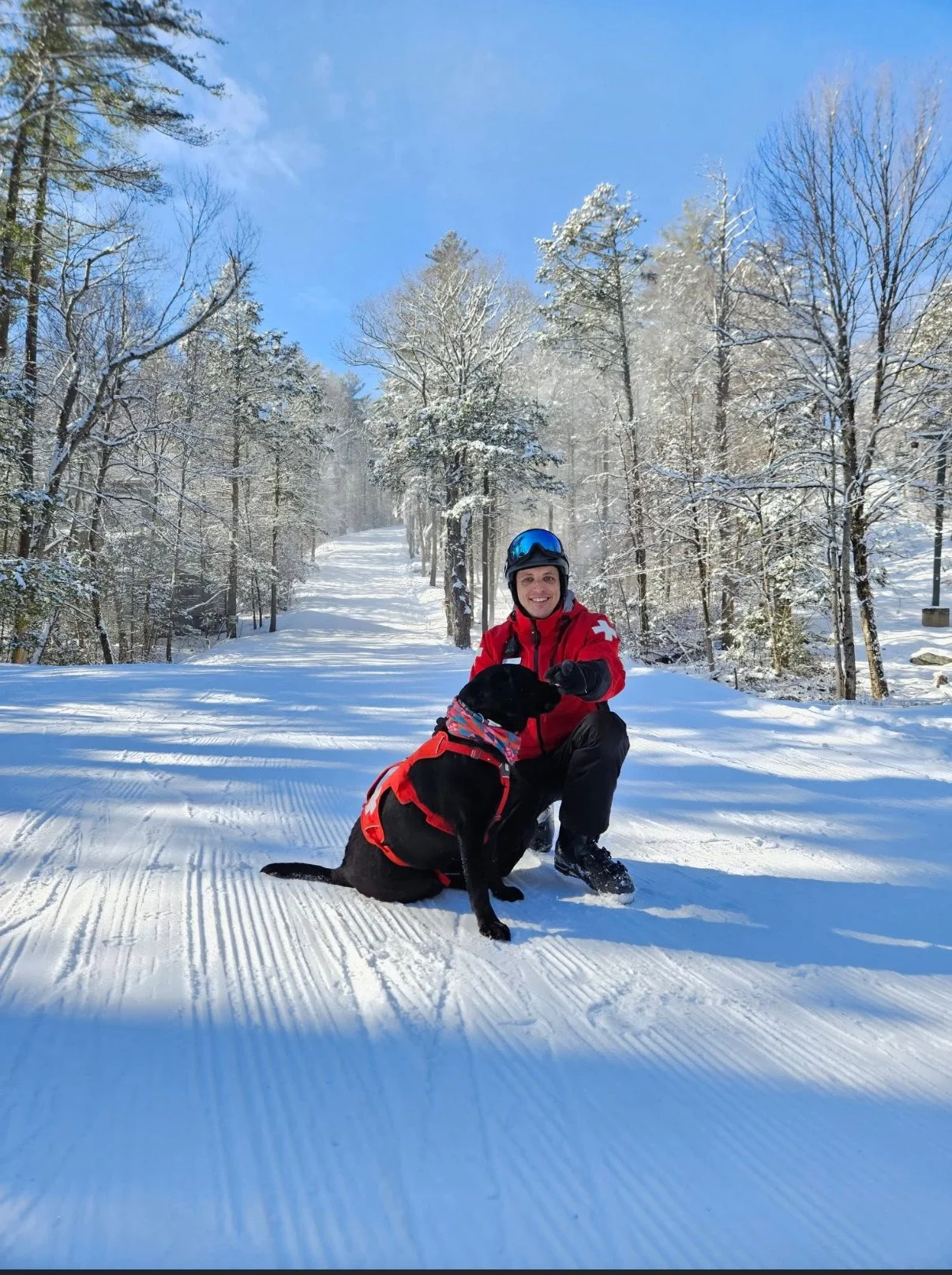 Gladys and her owner on the job with ski-patrol