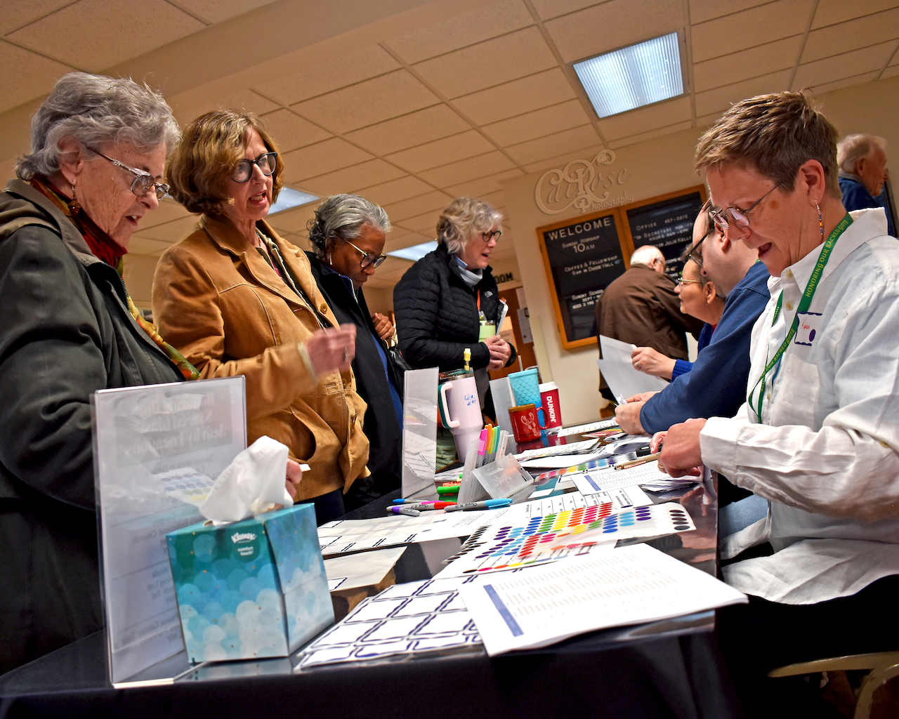 Four Women Registering In, credited.png