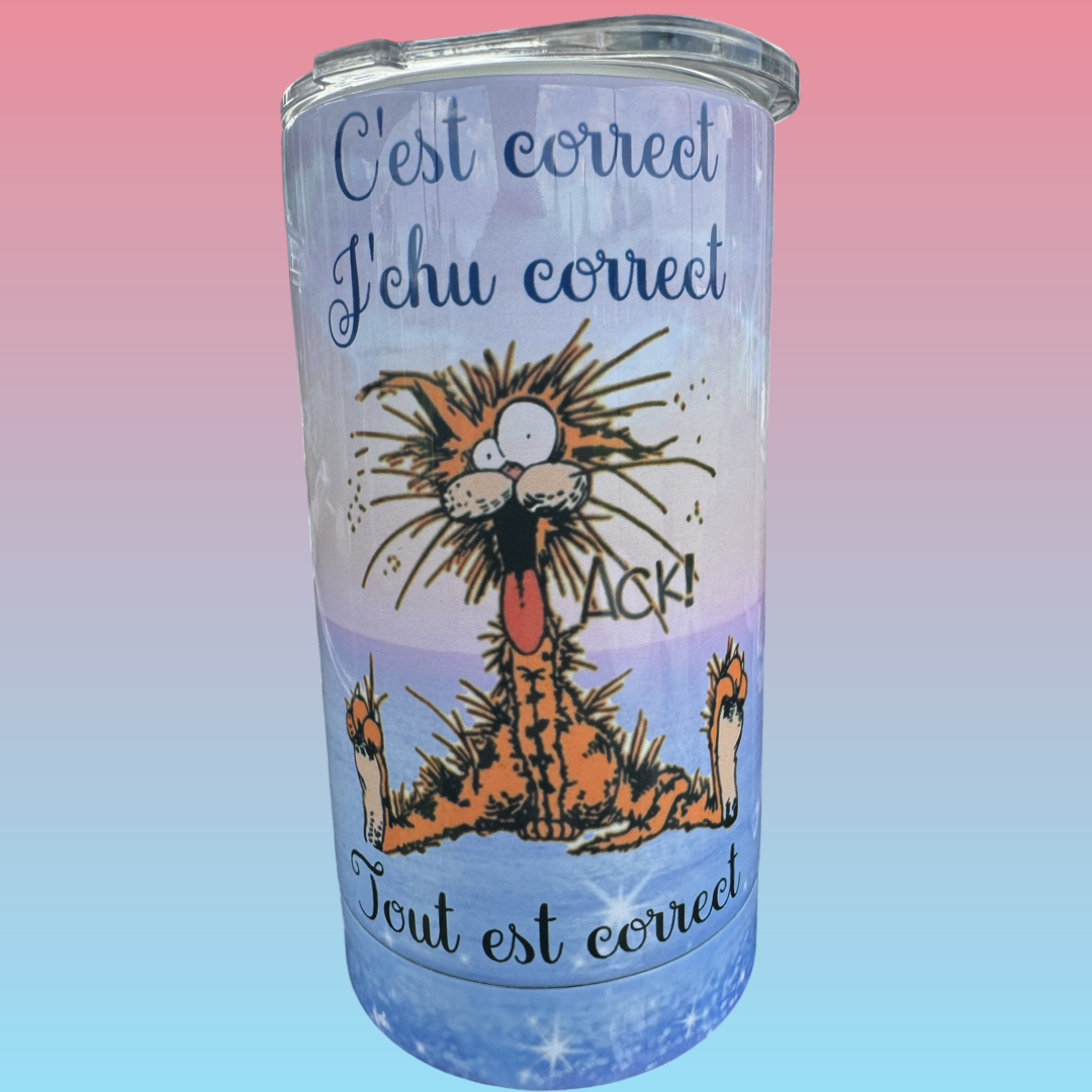 A tumbler cup featuring a cartoon lion with its tongue out, with French phrases 'C'est correct,' 'J'chu correct,' and 'Tout est correct,' on a pink and blue gradient background.