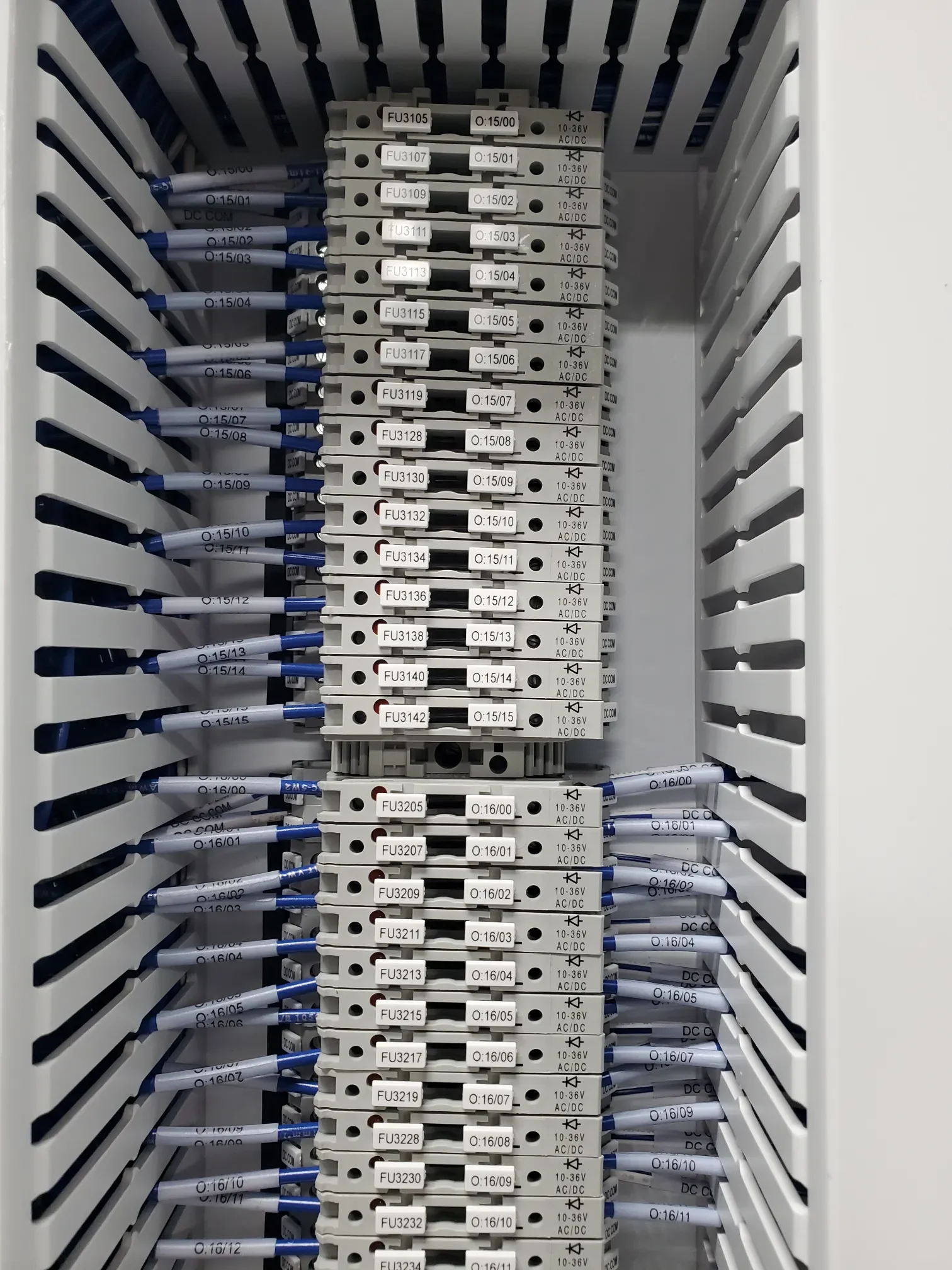 Electrical fuse panel with multiple circuit fuses and wiring connected to each fuse.