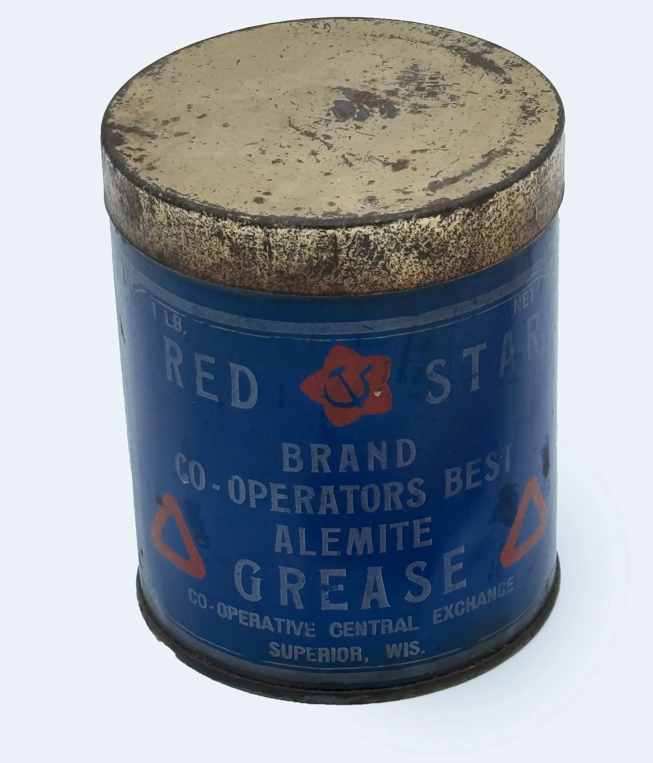 An old metal can with blue label for Red Star brand grease, featuring red star logo with an anchor, and text indicating it is from the Cooperative Central Exchange in Superior, Wisconsin.