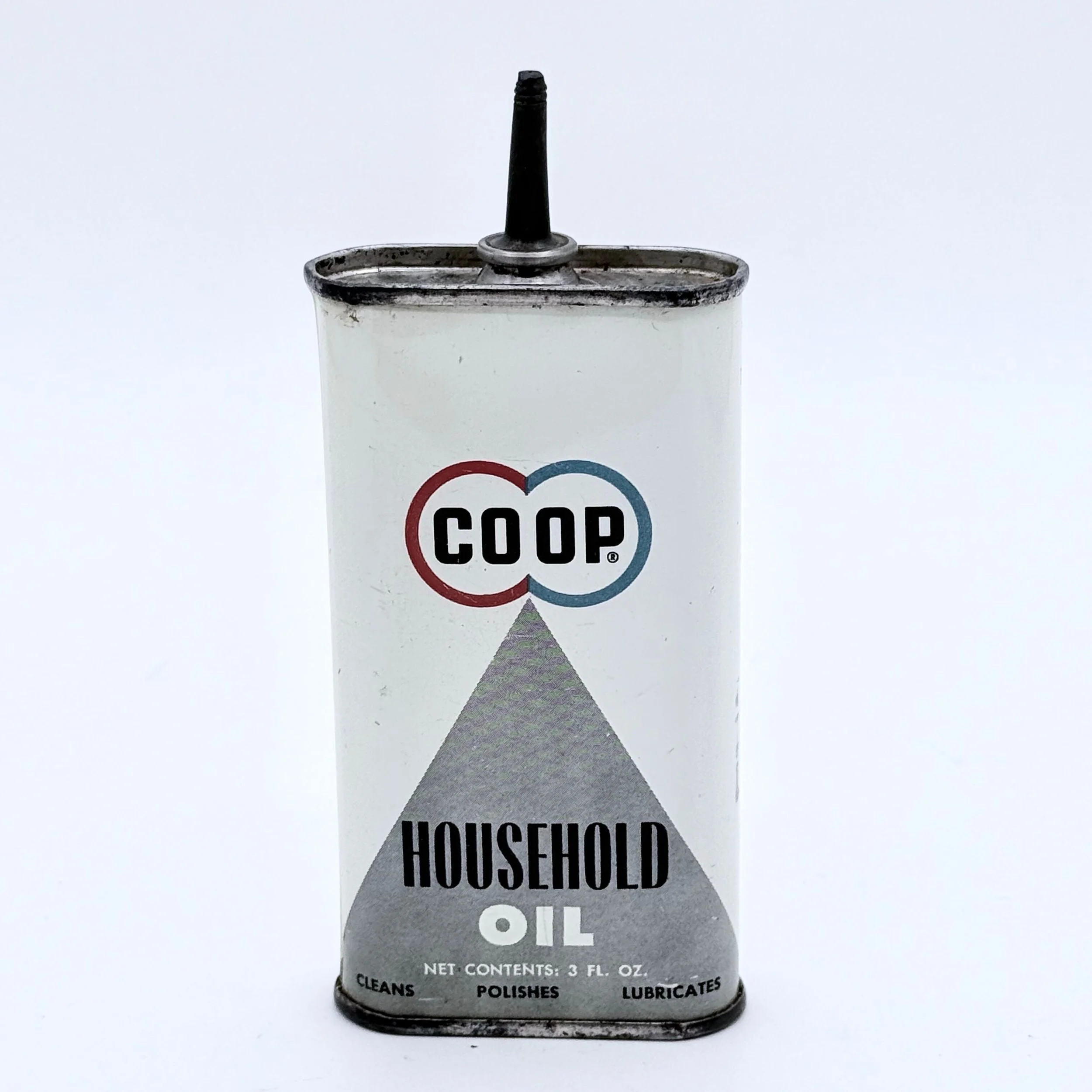 A vintage tin container of household oil with a spout, labeled "co op" and emphasizing cleaning, polishing, and lubricating functions.