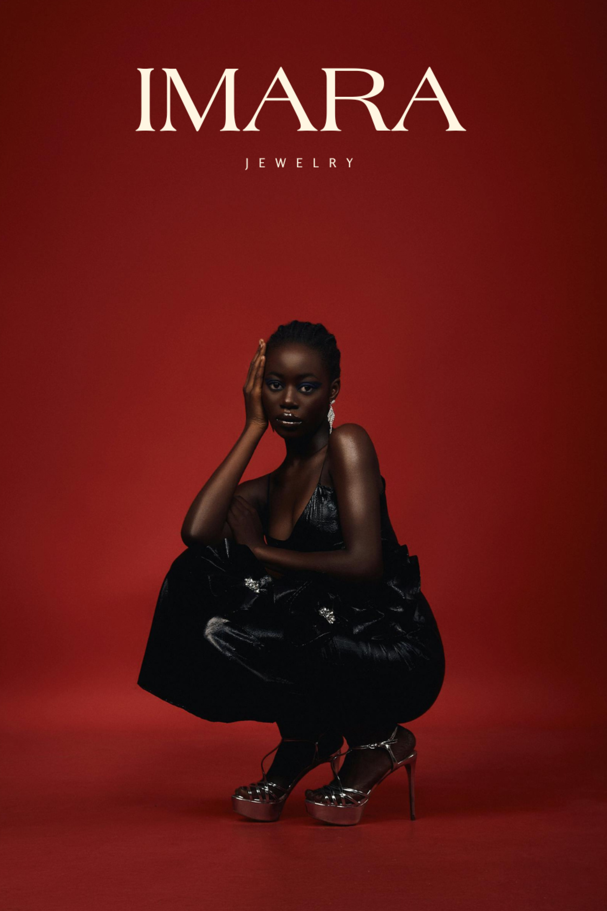 Advertisement for Imara Jewelry featuring a woman with dark skin wearing a black dress and platform heels, squatting against a red background with the brand name in white at the top.