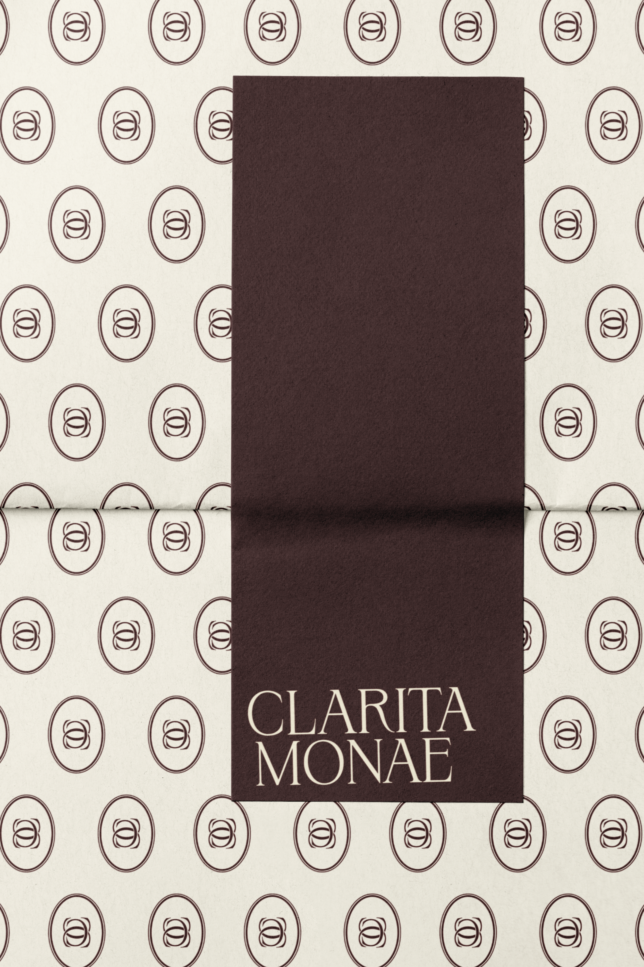 Packaging design for Clarita Monae with a patterned background of repeated oval logo symbols.