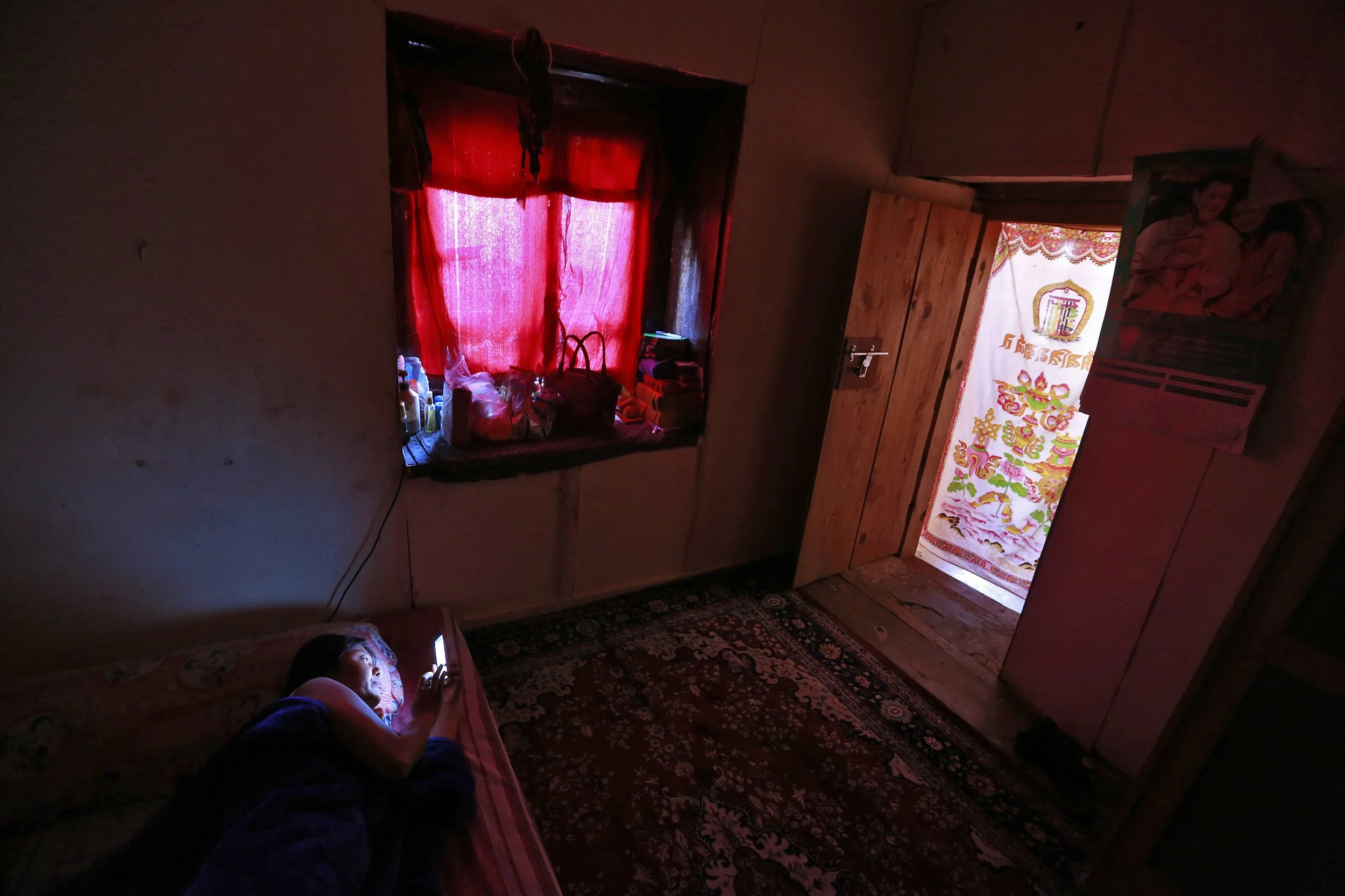 Woman rests at home, Thimpu.