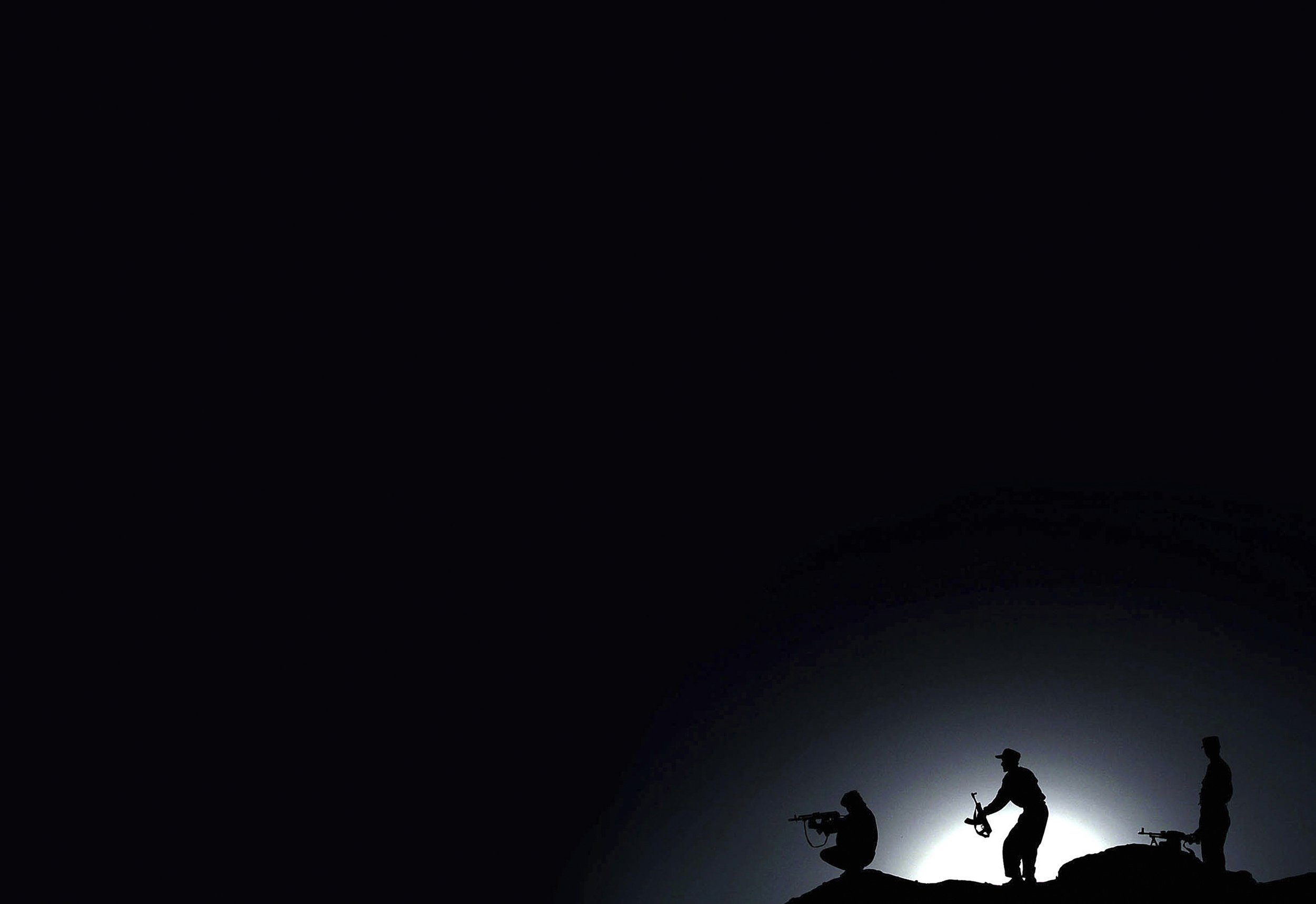 Soldiers on a hillside, Afghanistan.