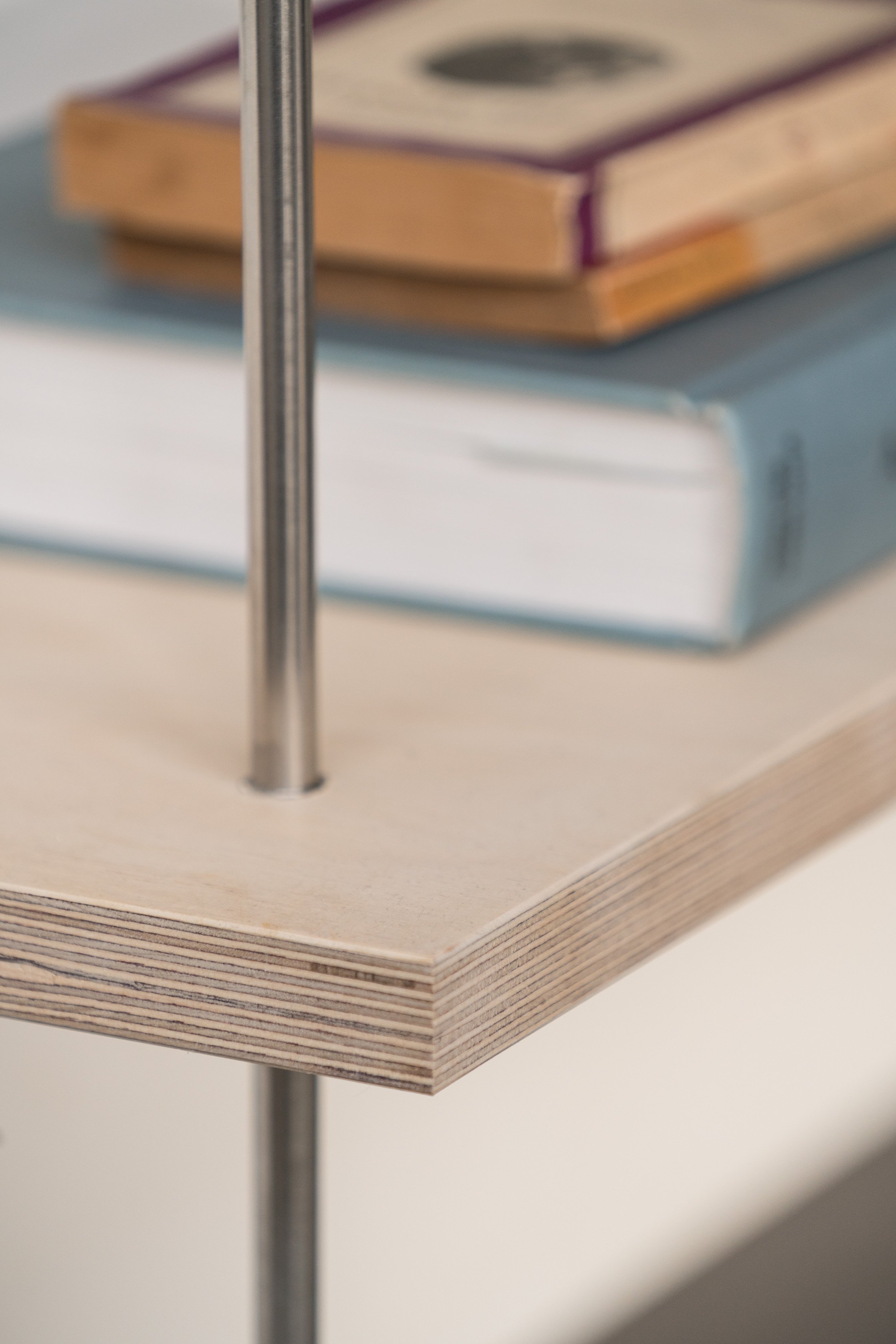 Close-up of bespoke birch ply book shelves