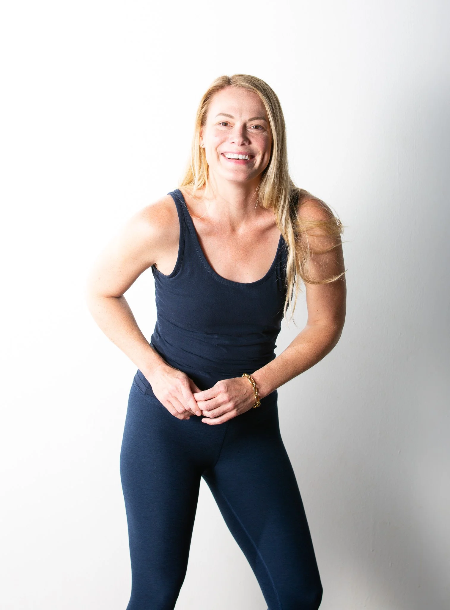 Sukha Yoga Austin Sculpt and infrared Power Teacher Gray Gilson, smiling at the camera.