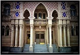Ornate building facade with Gothic arches and columns