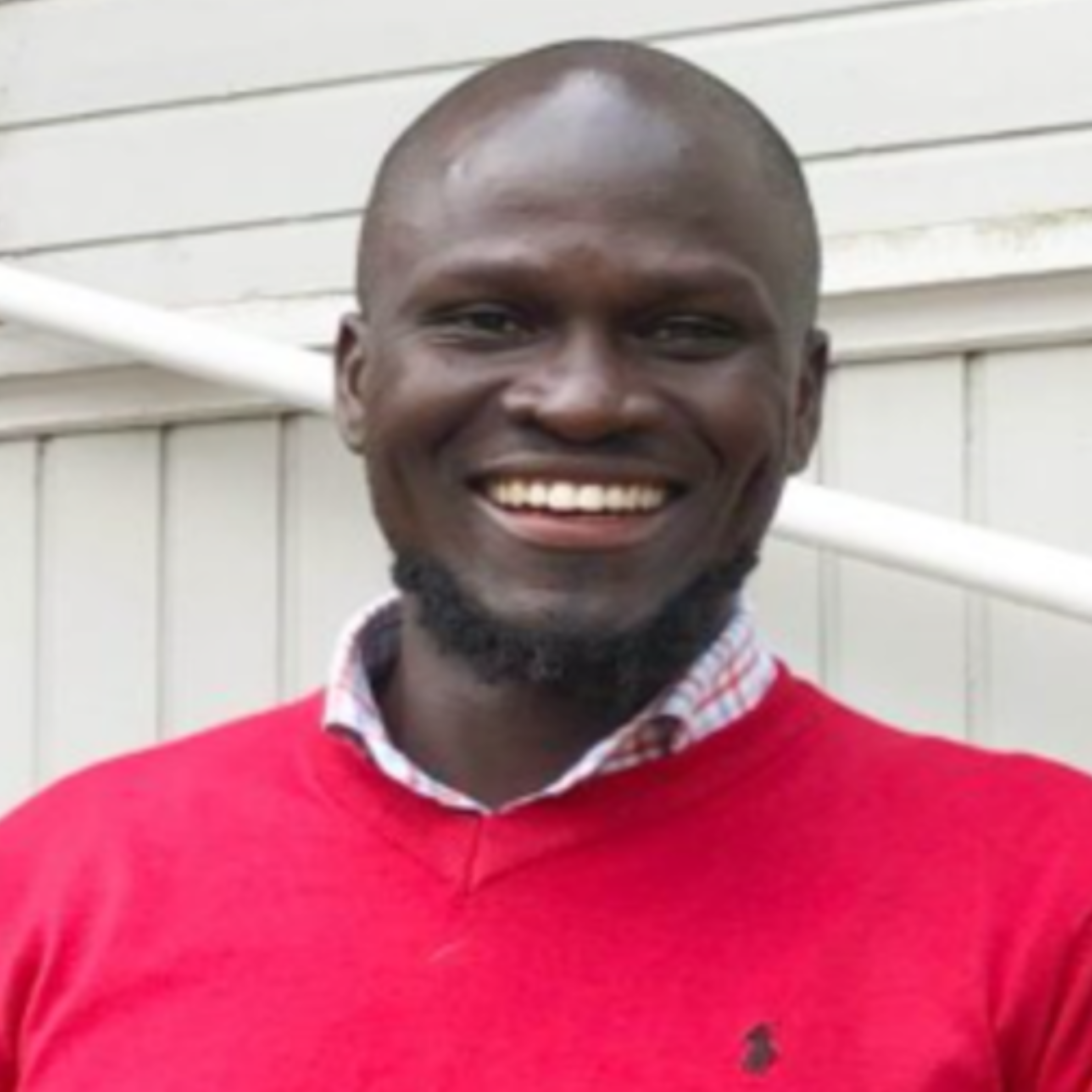A headshot of Cliff Omondi, Research Fellow.