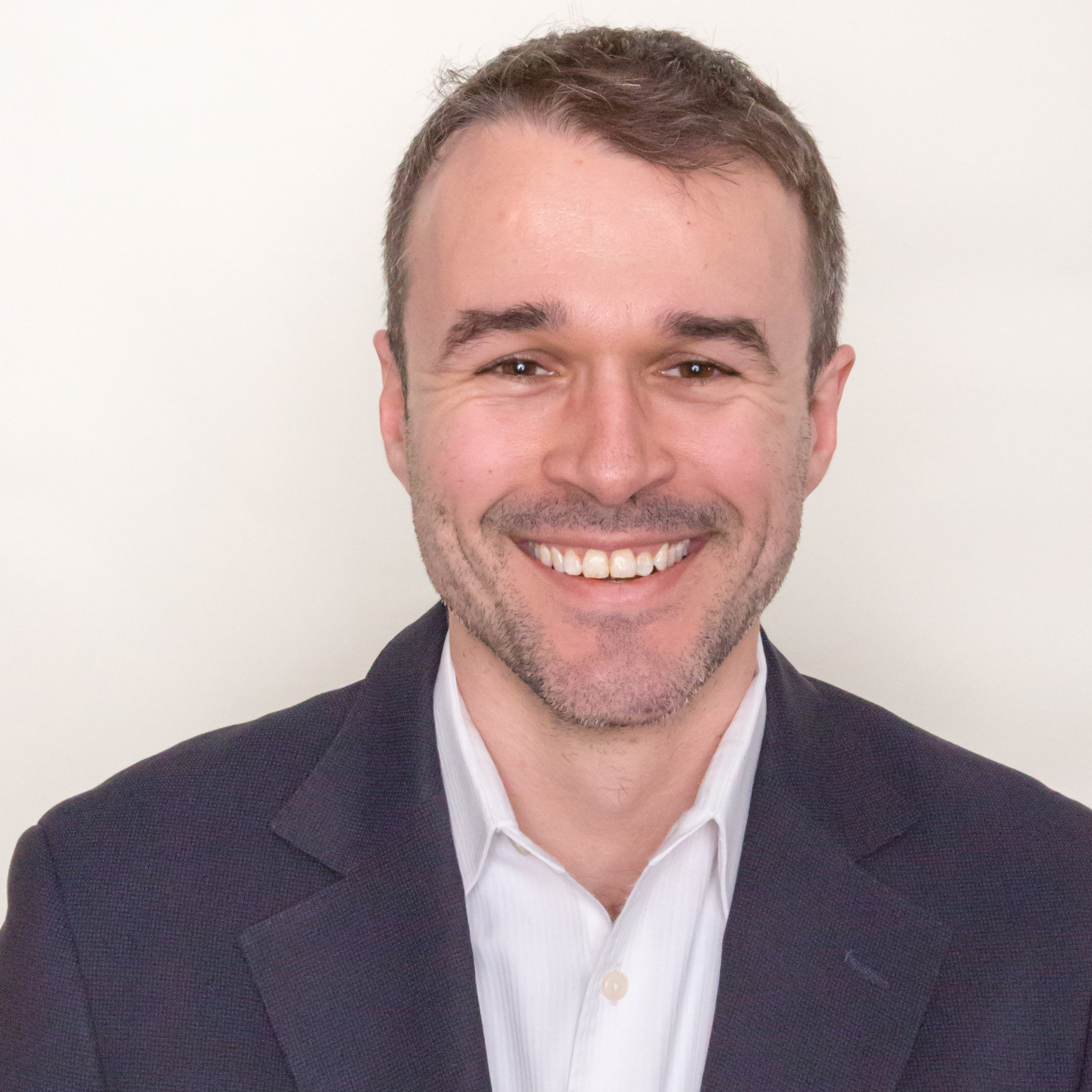 A headshot of Simon Wells, Senior Research Affiliate.