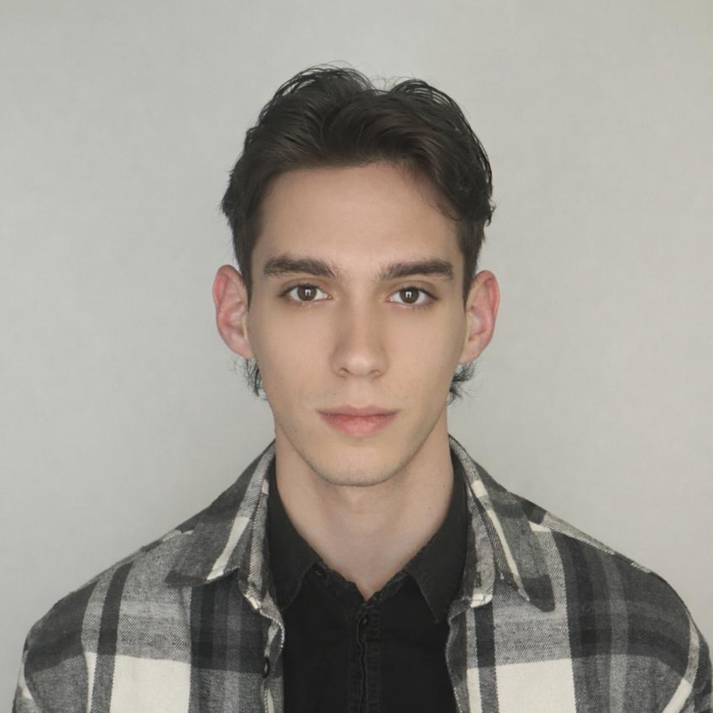 A headshot of Isaac Joseph Szego, Undergraduate Research Fellow.