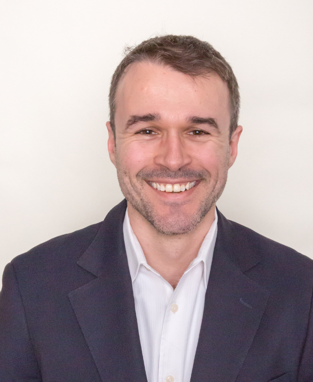 A headshot of Simon Wells, Undergraduate Research Fellow.