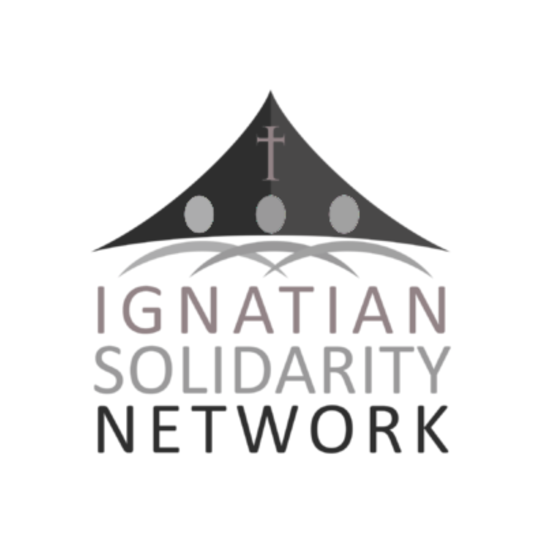 A logo for Ignatian Solidarity Network featuring a black tent with a cross on top and three circular symbols underneath, and the text Ignatian Solidarity Network in purple, gray, and black.