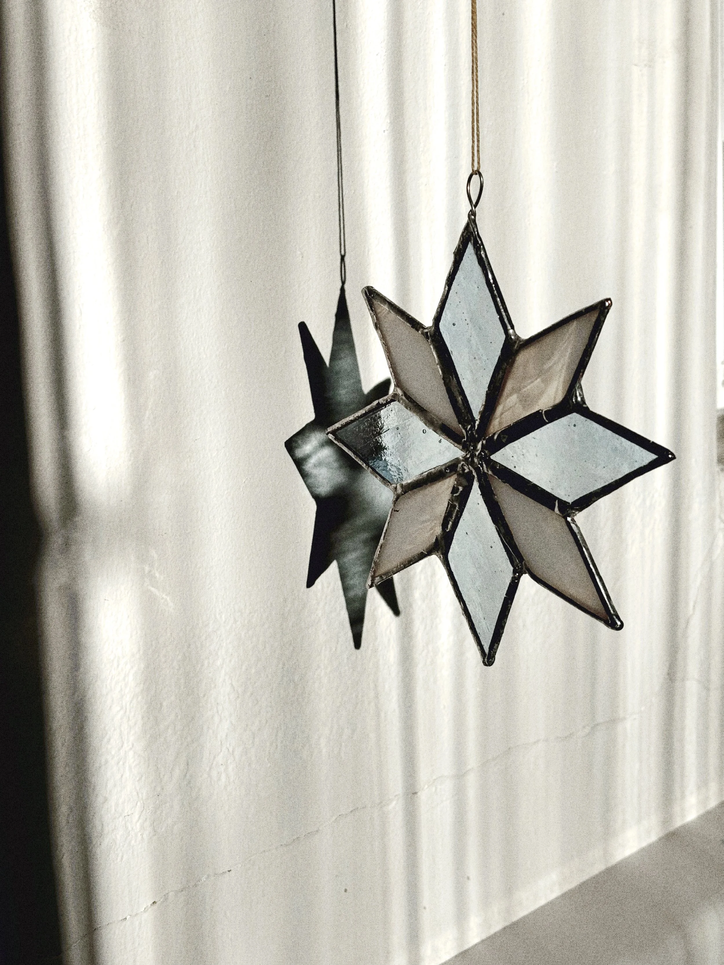 stained glass star with beige background