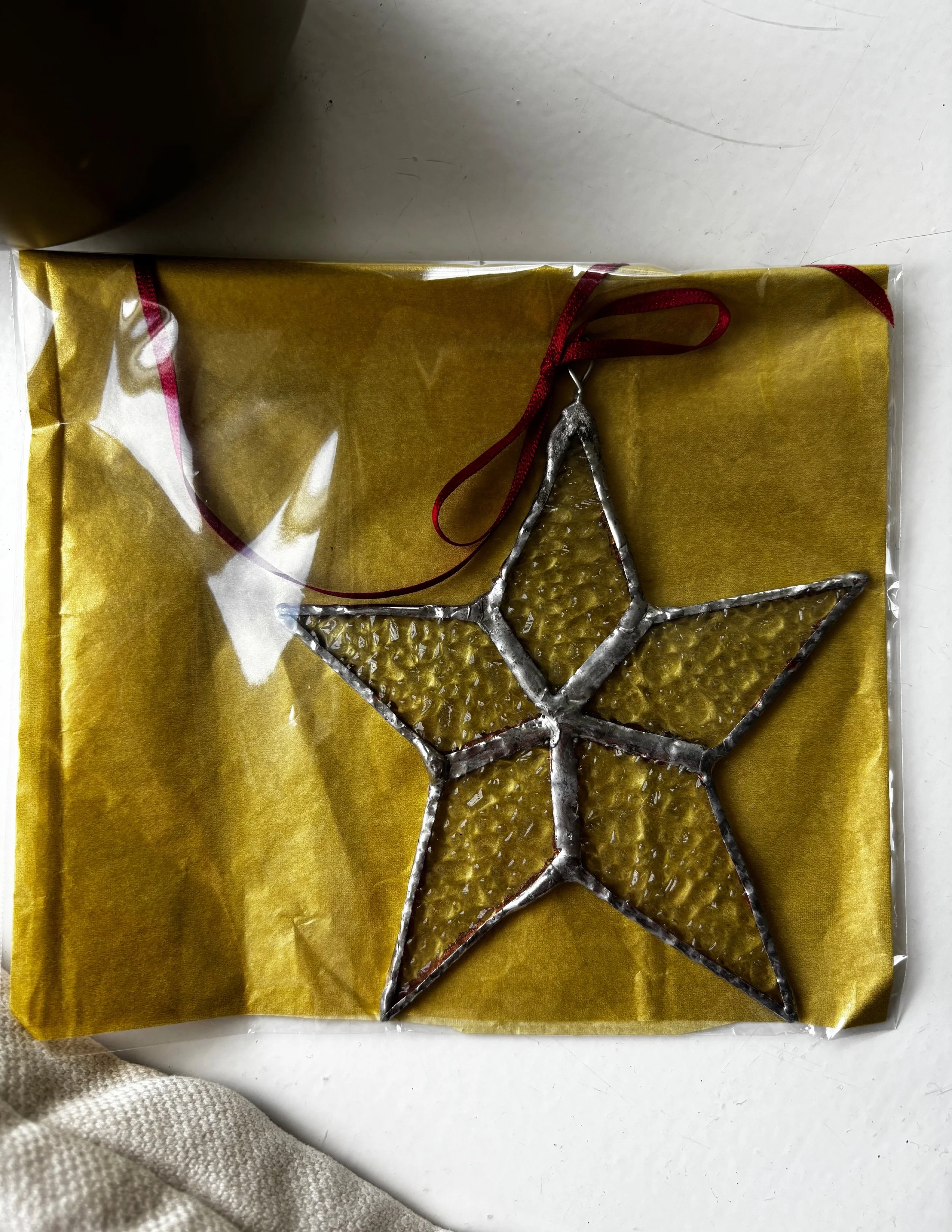 Yellow star in plastic bag