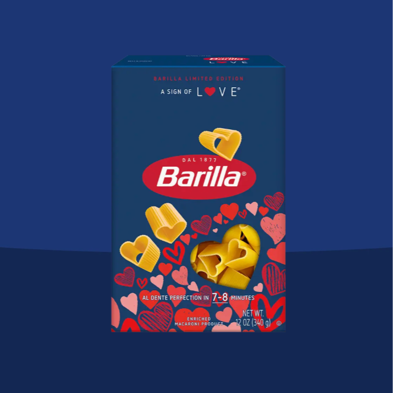 A box of Barilla pasta with heart-shaped pasta pieces and heart illustrations on the packaging, indicating it's a limited edition for Valentine's Day.