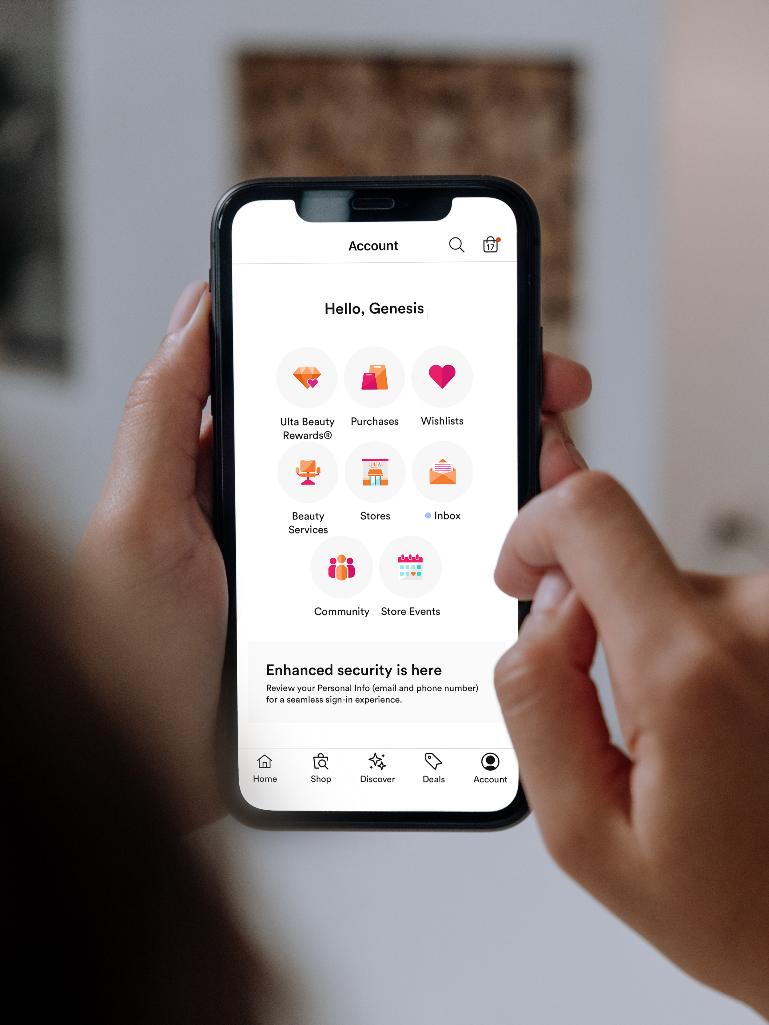 A person holding a smartphone displaying a loyalty and rewards app with options for rewards, purchases, wishlists, beauty services, stores, inbox, community, and store events.