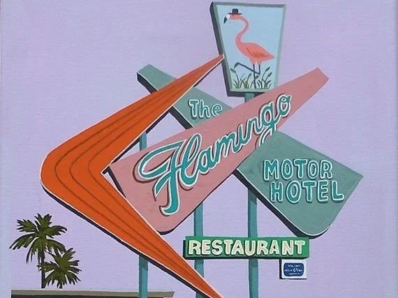 Vintage sign for The Flamingo Motor Hotel and Restaurant, featuring a stylized flamingo and palm trees.