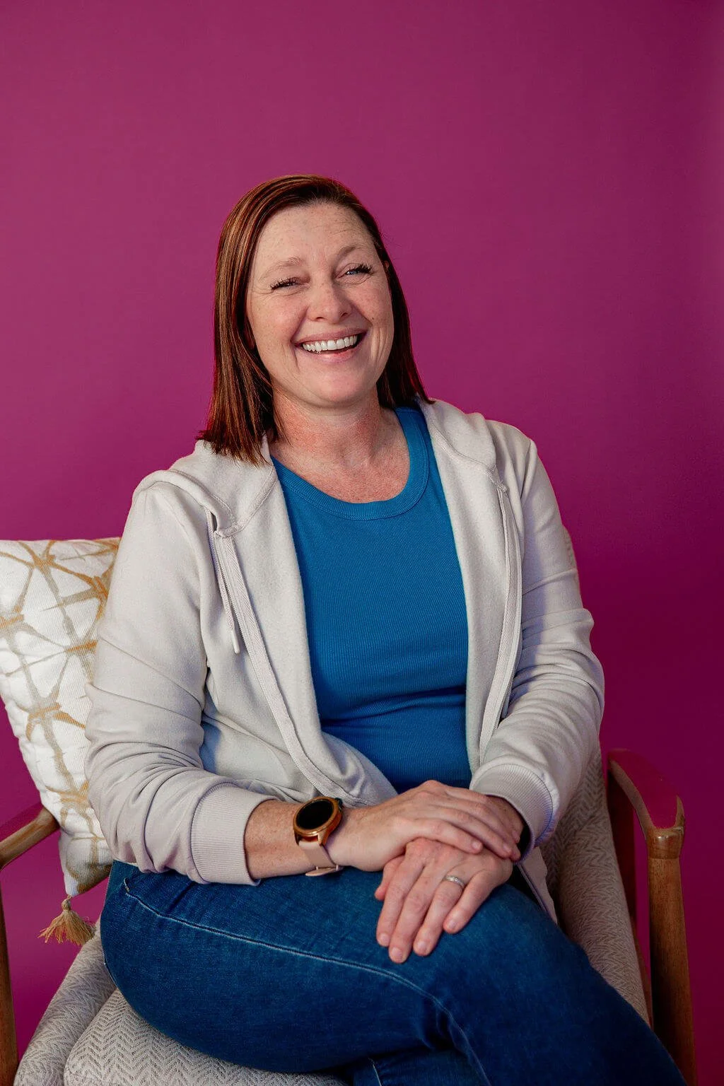 Liz Chapman, podcast seo strategist, is looking at the camera and smiling
