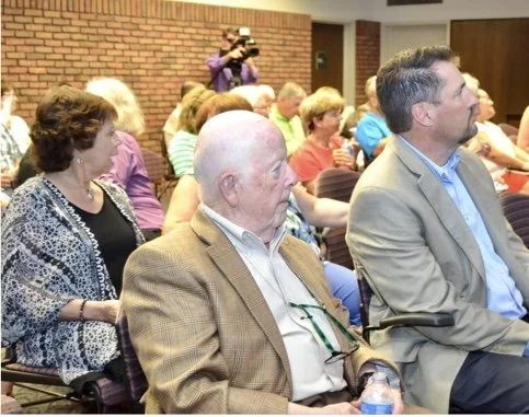 Attendees listening to a speech by Festival Foods Chairperson, Dave Skogen.