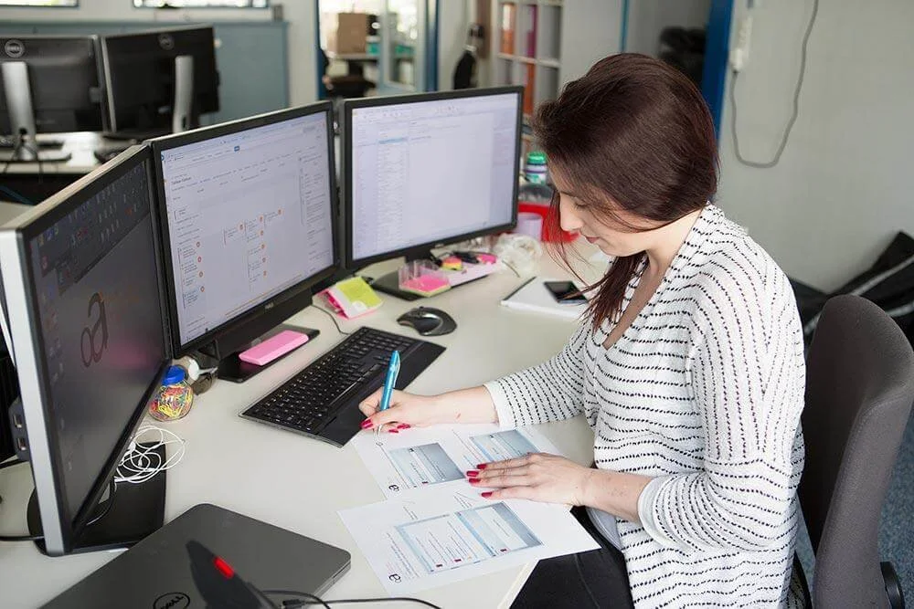 Security analyst monitoring systems and documenting cybersecurity activities.