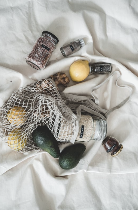 Laurie’s customers, Mariana and Carmen holding hands on a green lawn on their wedding day.