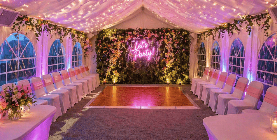 A vibrant marquee setup with ambient lighting, perfect for evening celebrations, parties, and unforgettable wedding receptions.