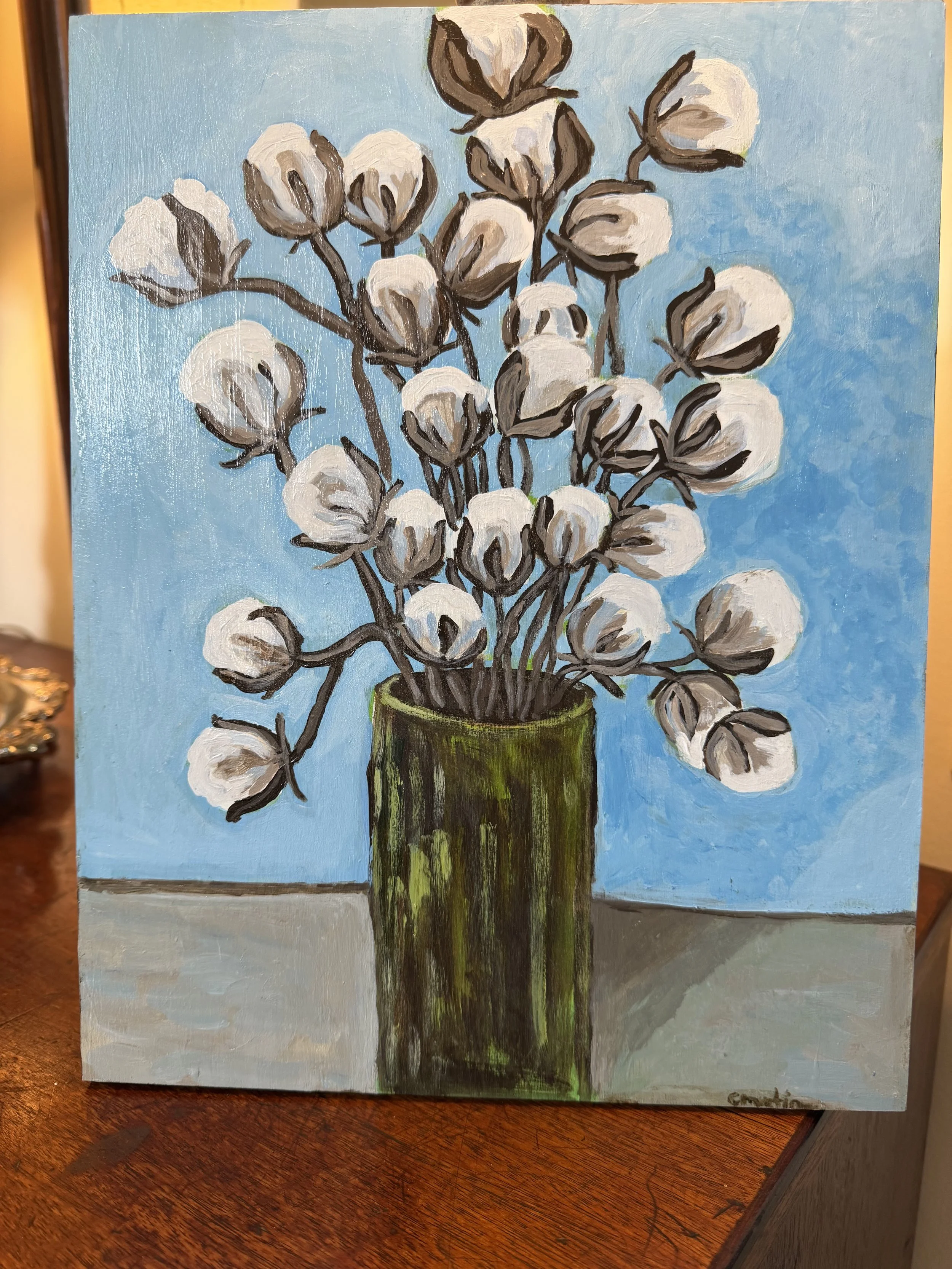 Cotton in a green vase