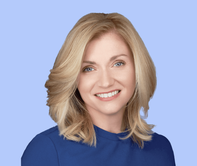 Eleni DeGraw, a smiling woman with blonde hair wearing a blue top, set against a light blue background.