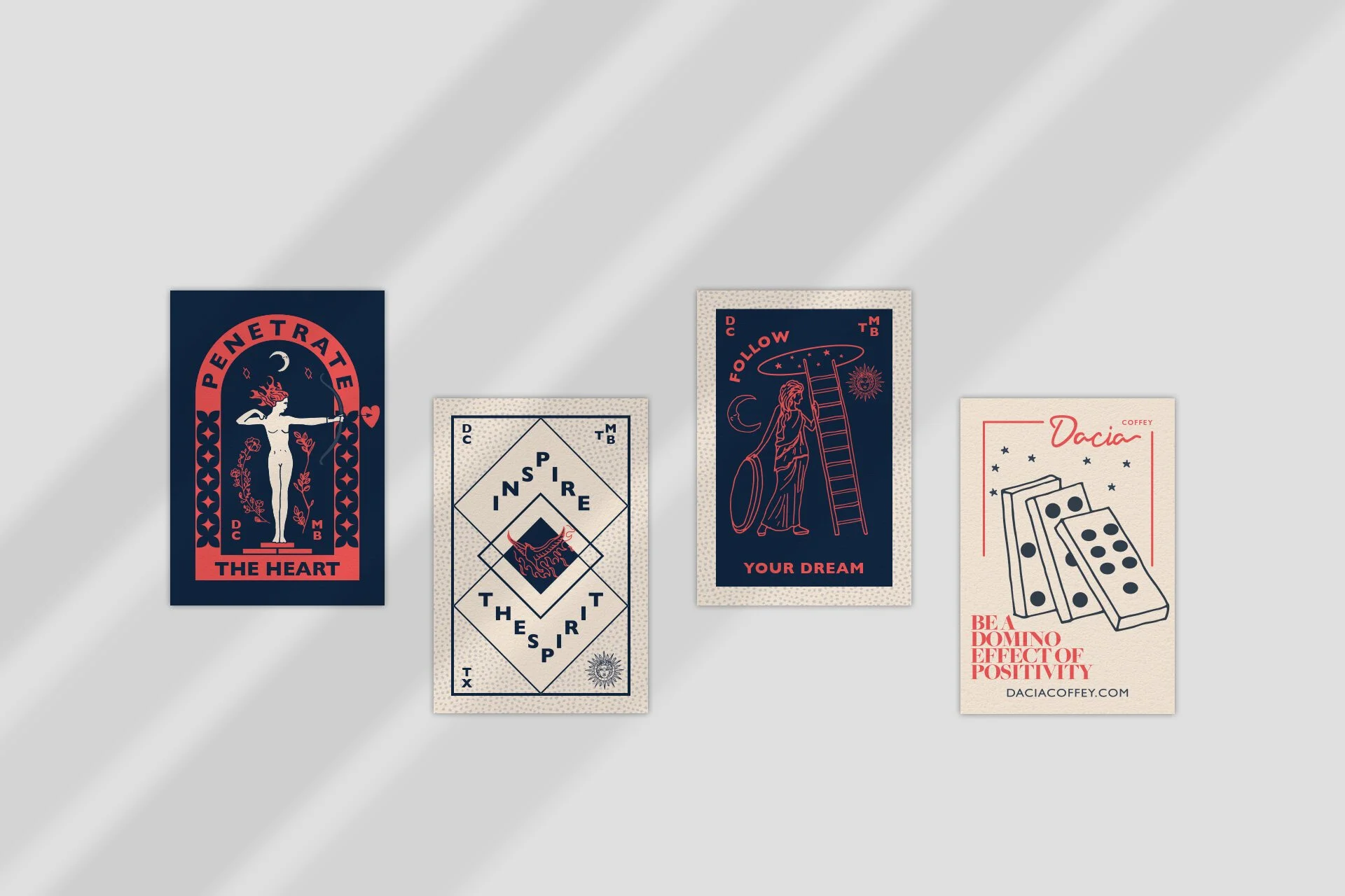 Four printed cards with various designs and text, laid out on a light surface. The first card features a stylized figure of a woman with a bow and arrow, with the text "Penetrate The Heart." The second card has geometric patterns with the words "Insp