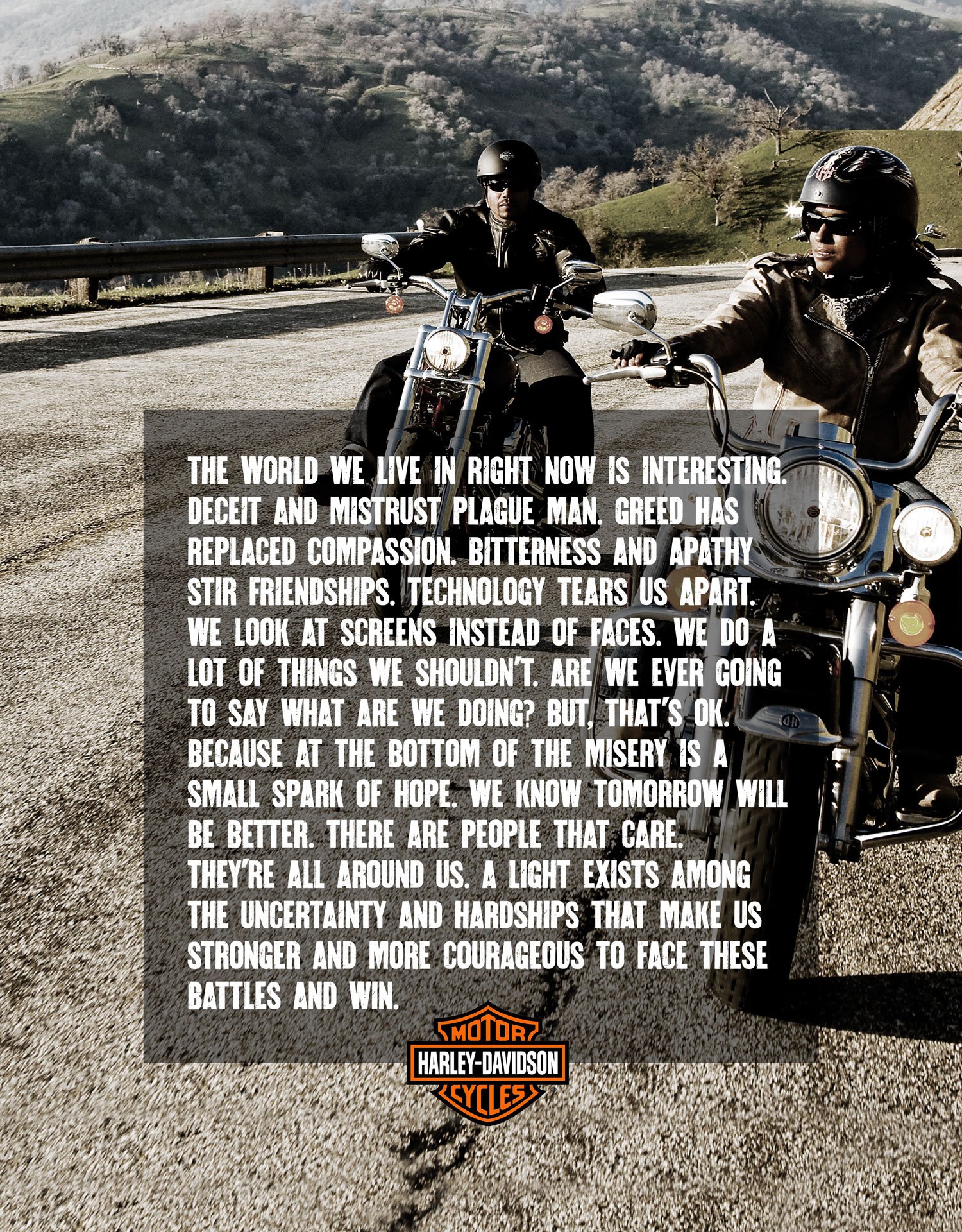 Two motorcyclists riding Harleys on a mountain road with hills and trees in the background.