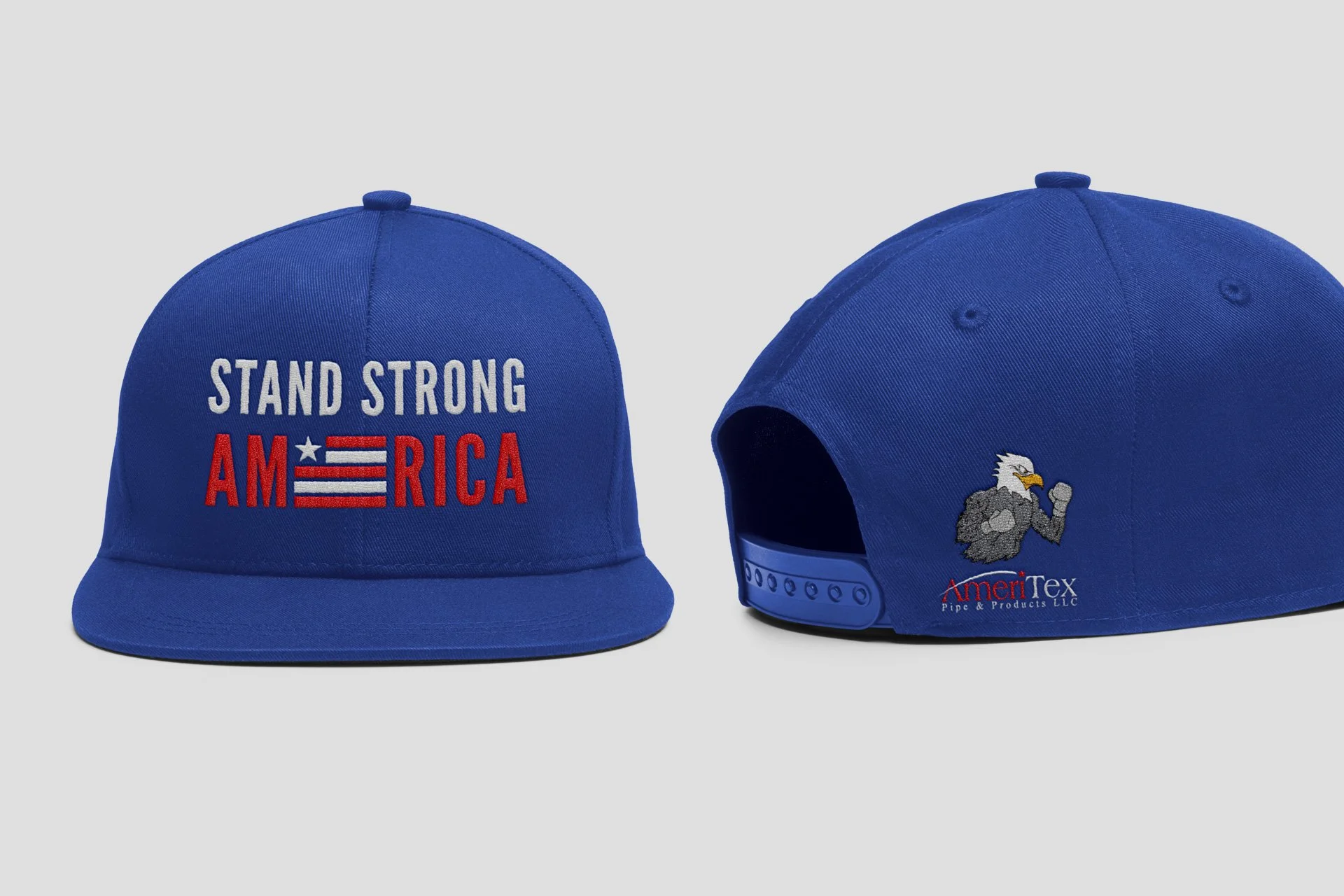 Blue baseball cap with embroidered message 'STAND STRONG AMERICA' on front, and an American eagle logo with 'AmeriTex Pipe & Products LLC' on the back.