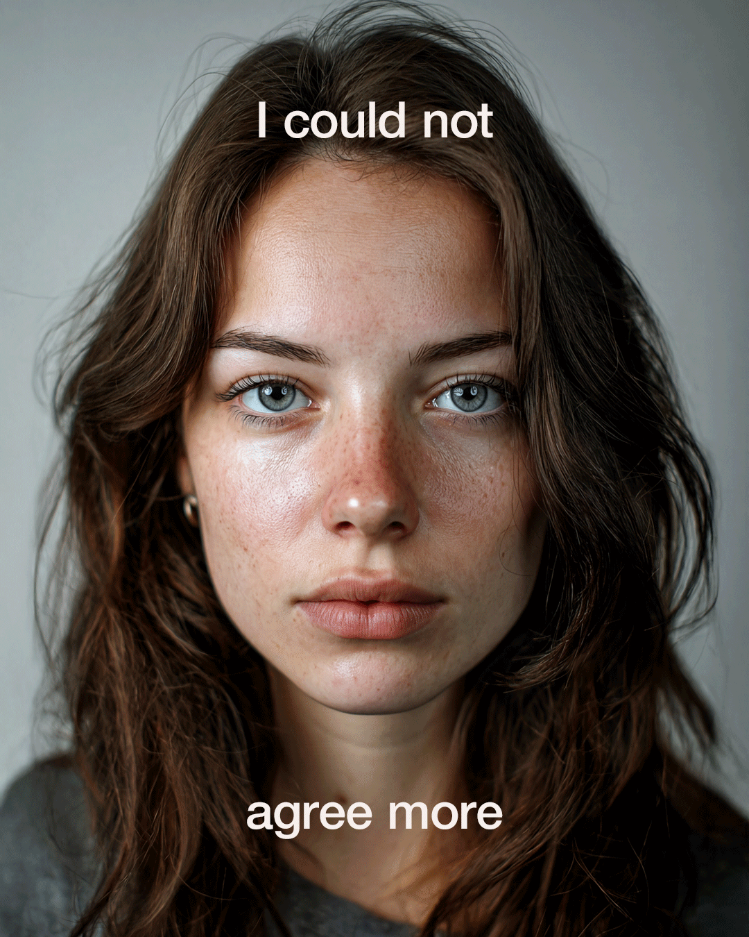 Close-up portrait of a woman with blue eyes and brown hair, with text overlay saying 'I could not agree more.'